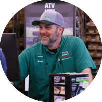 A man is standing in a store, smiling and showing a computer screen to another person. AI generated content